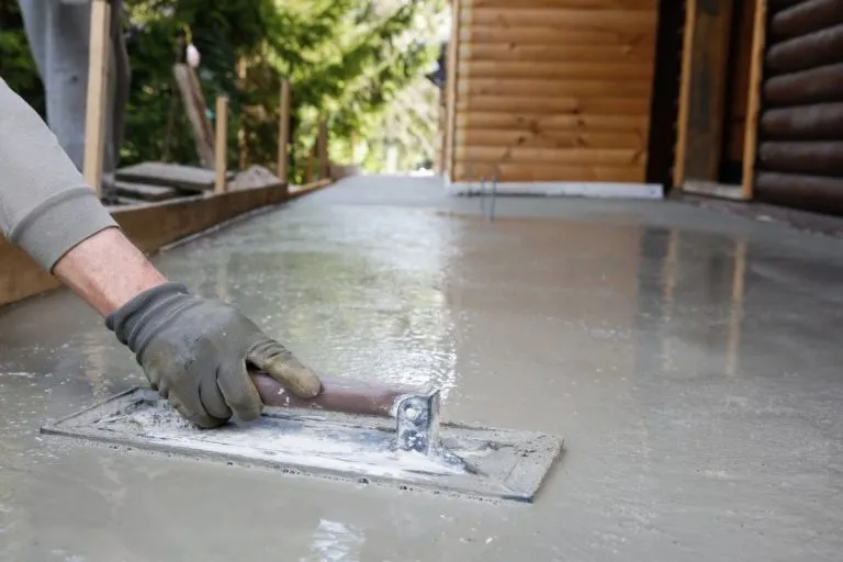 Smoothing concrete by hand