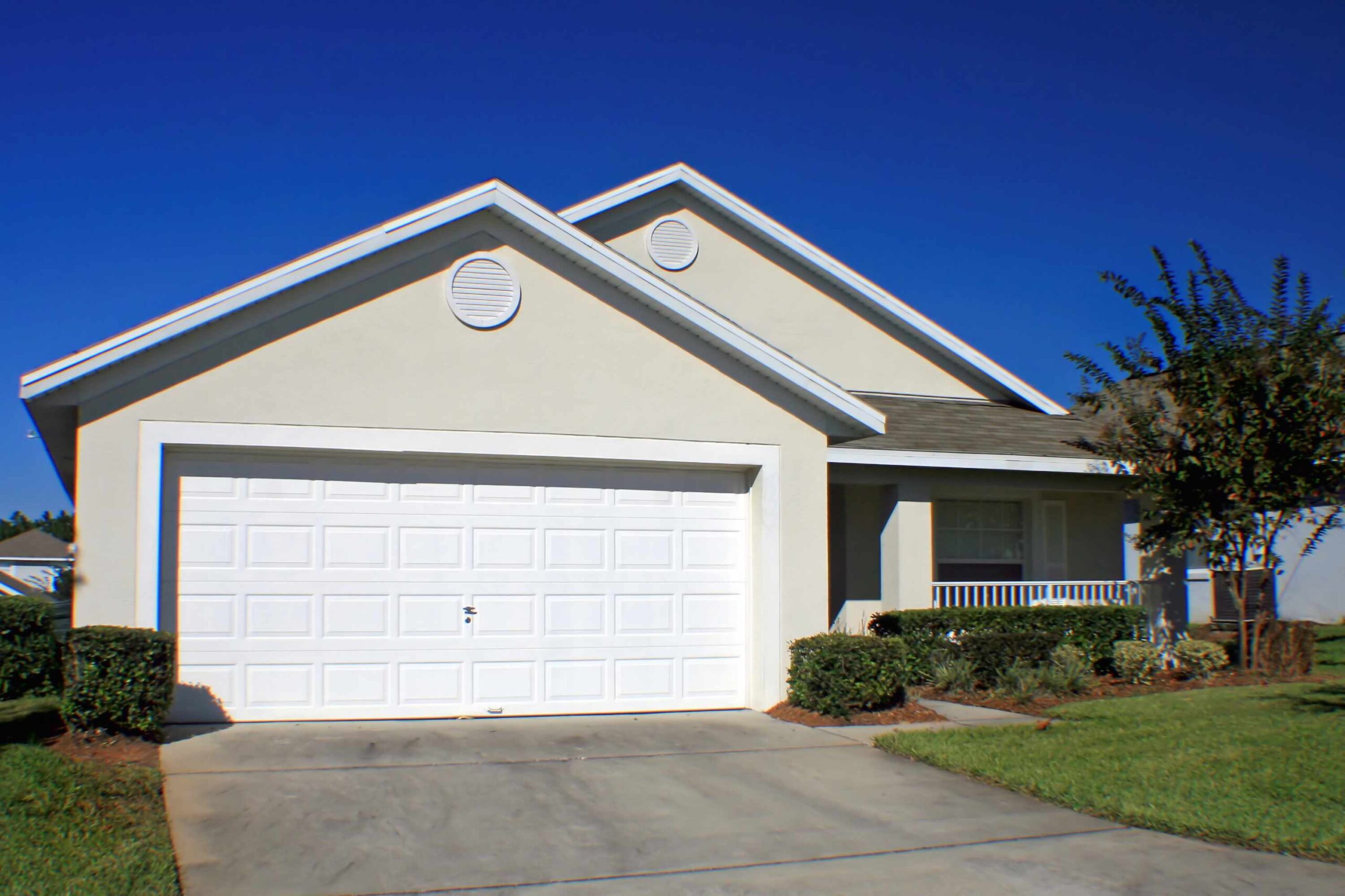 A front exterior of a block and stucco Florida home.